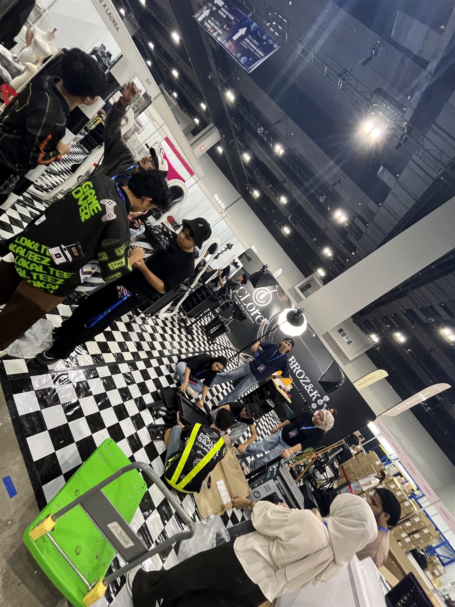 The team across the checkered-floor BrozKey booth